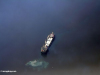 Aerial photograph of ship dumping waste into the sea